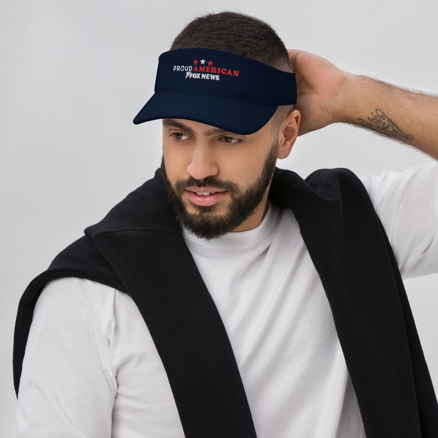 The red and navy variants of the FOX News Proud American visor displayed together against a clean background.