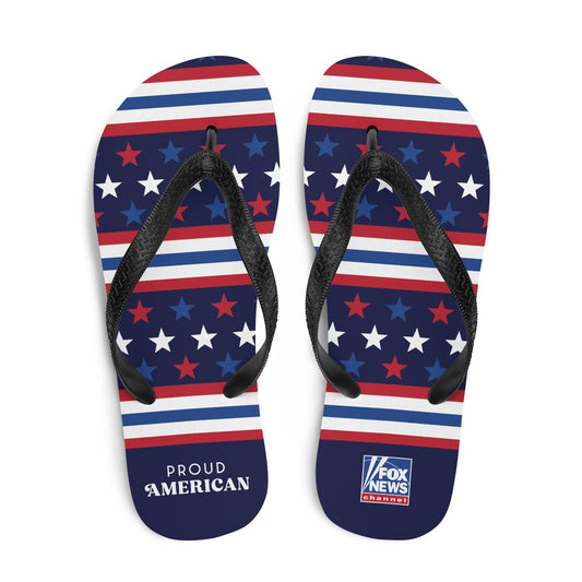A pair of FOX News Proud American flip flops featuring a patriotic red, white, and blue design with the FOX News logo, set against a clean American backyard background.