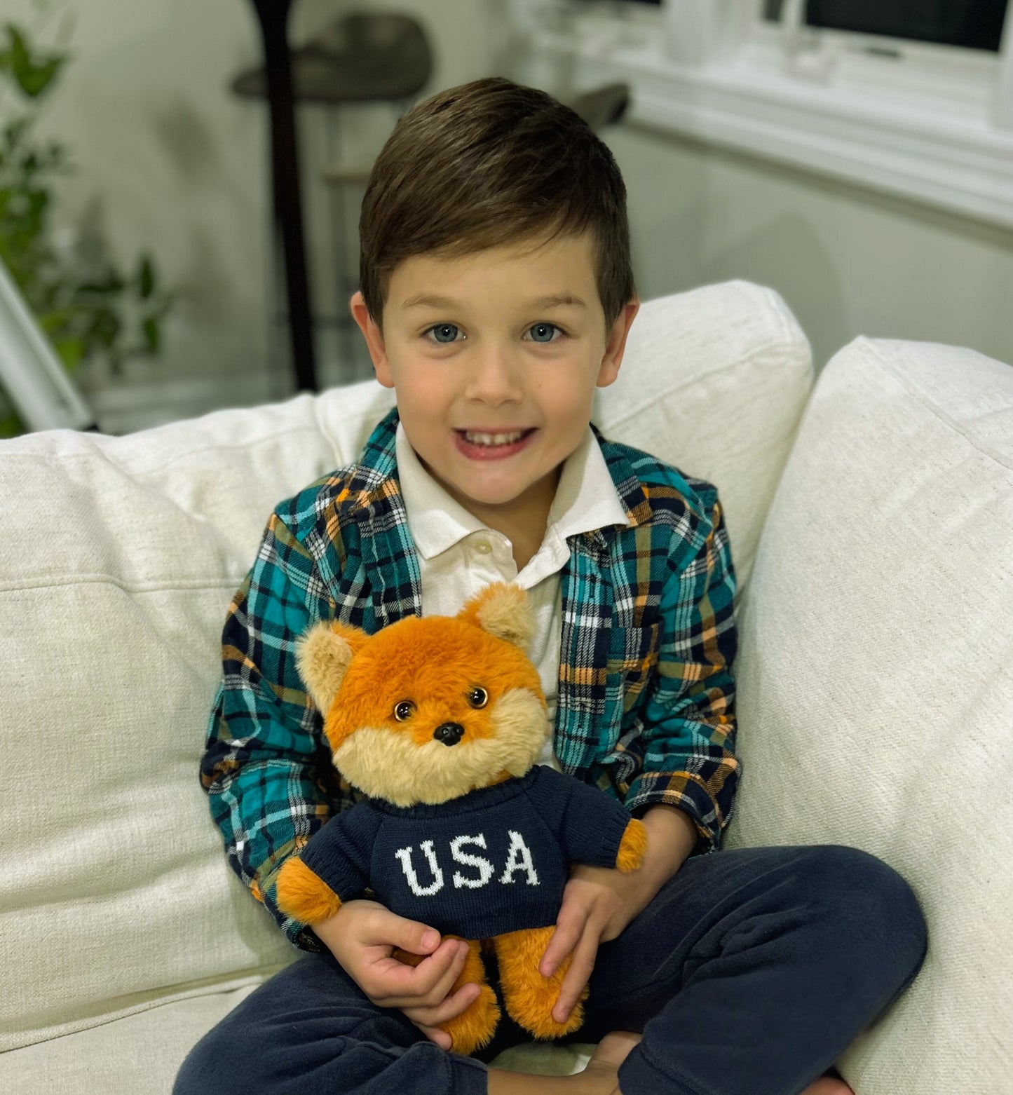 The For All America Fox Plush displayed next to a FOX News mug in a cozy morning setting.