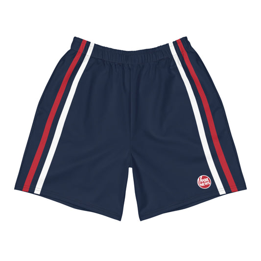 A pair of FOX News Logo Unisex Athletic Shorts displayed in a clean, modern American home gym setting.