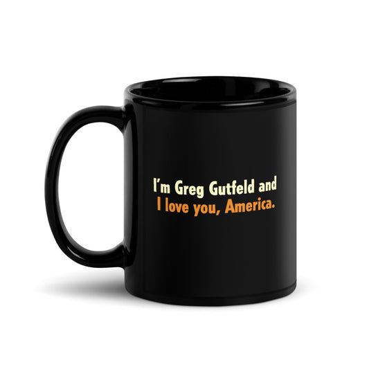 A black glossy Gutfeld! ceramic mug featuring white text that reads I'm Greg Gutfeld and I love you, America in a clean American kitchen setting.
