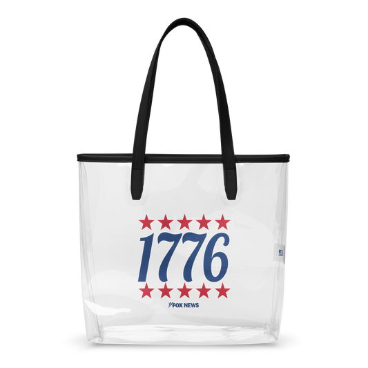 A FOX News 1776 Clear Tote Bag sitting on a wooden table in a sunlit, suburban American home.