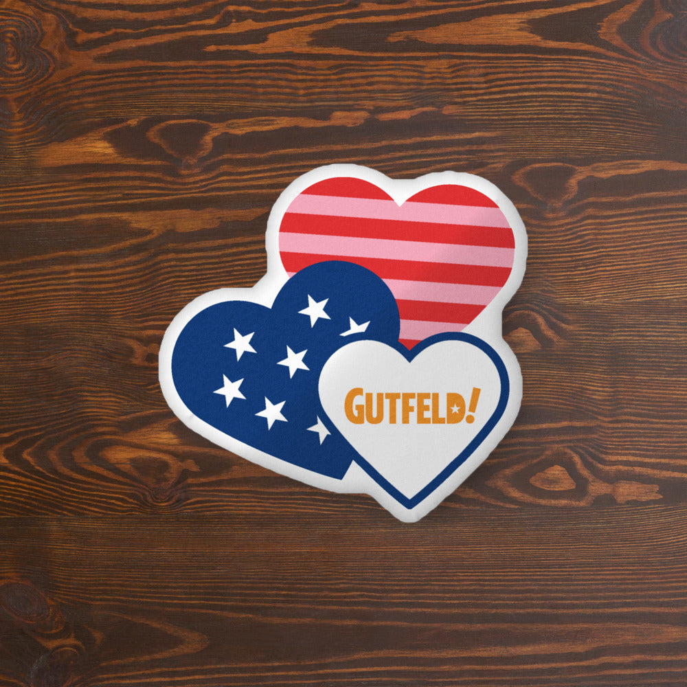 Close-up of the Gutfeld! Hearts Pillow showing the vibrant red and white graphic design and official branding.