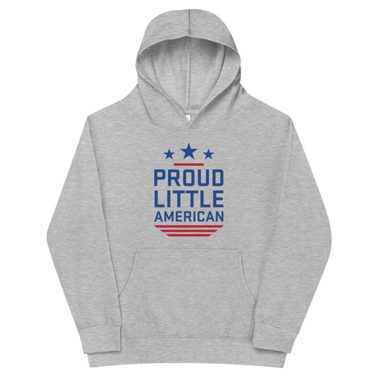 A young child wearing the *FOX News* Proud Little American kids hoodie in a clean, sunny American backyard.