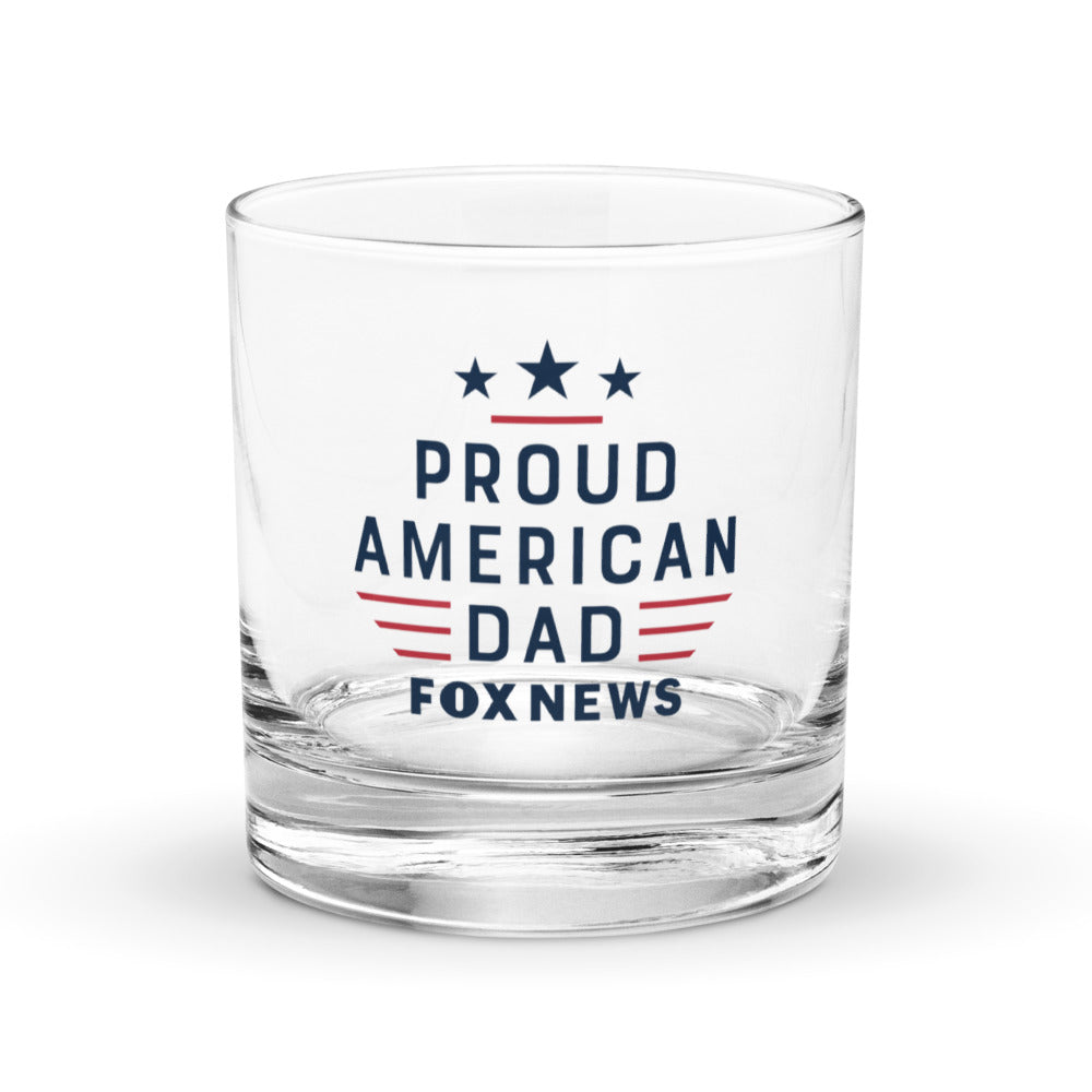 A close-up of the 10.5 oz FOX News rocks glass filled with whiskey and ice, showing the high-quality print detail.