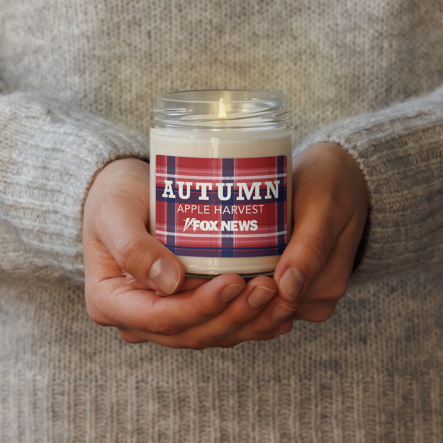 Two FOX News Autumn Scented Candles shown side-by-side in Apple Harvest and Cinnamon Vanilla variants.