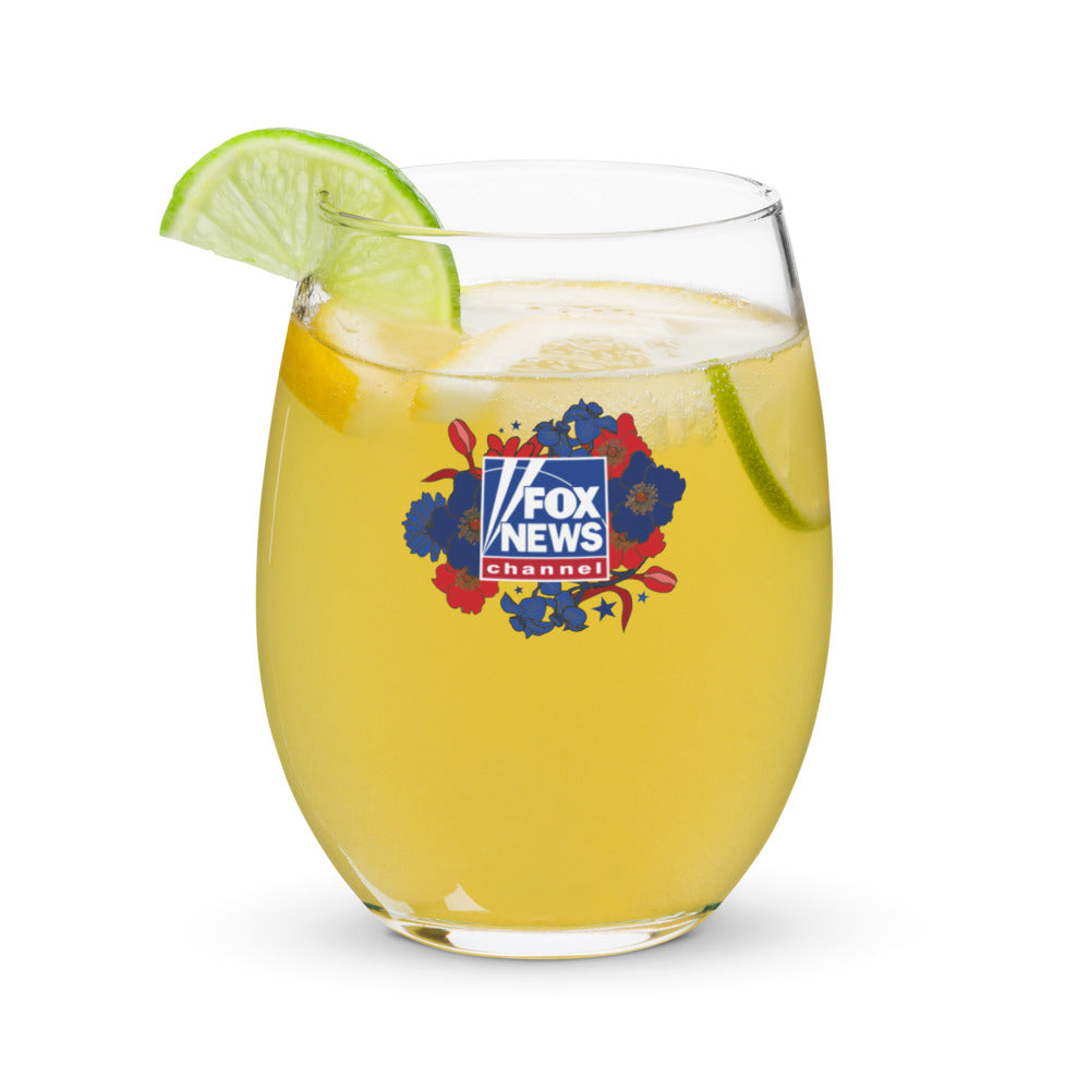 An outdoor patio lifestyle setting showcasing the FOX News Proud American Mom stemless wine glass under warm natural sunlight.