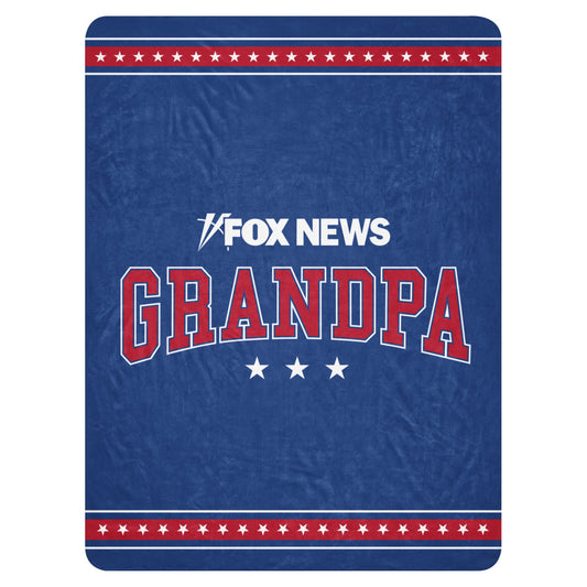 A premium FOX News Grandpa Sherpa Blanket draped neatly over a sofa in a bright, modern American home.