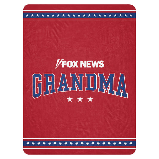 A cozy FOX News Grandma Sherpa Blanket displayed in a bright, modern American living room.