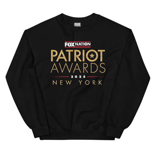 A patriotic American man wearing the FOX Nation Patriot Awards 2025 sweatshirt in a clean, suburban backyard setting.