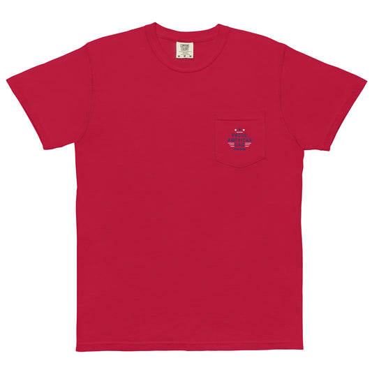 A man in a modern American backyard wearing a Navy Blue FOX News Proud American Dad pocket t-shirt.