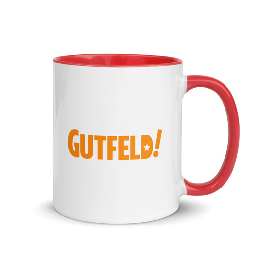 A white ceramic Gutfeld! Hearts Two-tone Mug with a vibrant red interior and handle sitting on a clean, modern kitchen table.