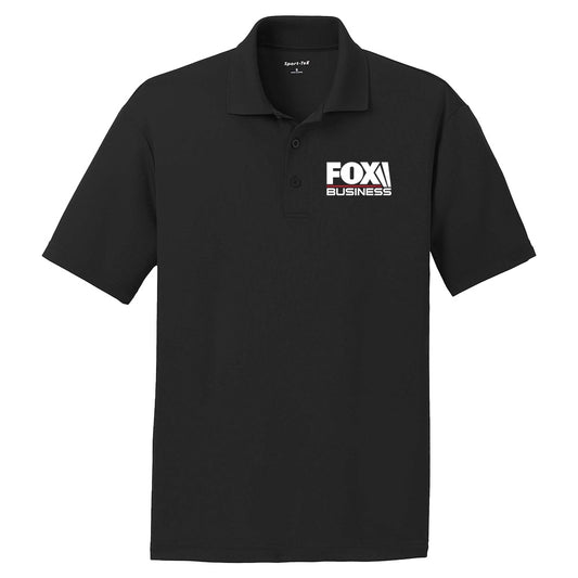 A man wearing a black FOX Business Logo Embroidered Polo in a professional home office setting.