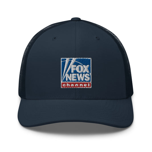 A modern American living room setting with a FOX News retro trucker hat resting neatly on a wooden accent table.