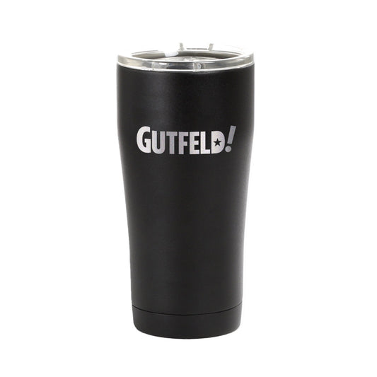 A Gutfeld! Logo Black Tumbler featuring the bold white show logo on a sleek matte black finish in a clean American kitchen setting.