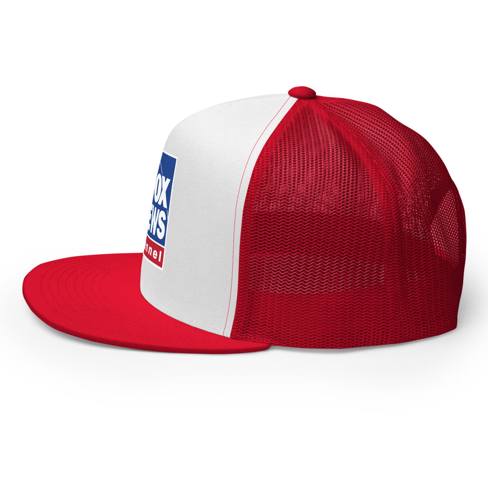 Close-up shot of the embroidered FOX News logo on the front crown of the red and white trucker hat in a bright outdoor setting.