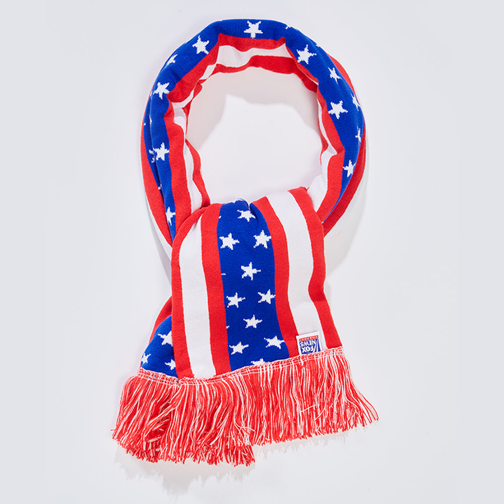 A person wearing the FOX News Flag Scarf outdoors during a crisp morning, highlighting the bold colors and crisp logo placement.