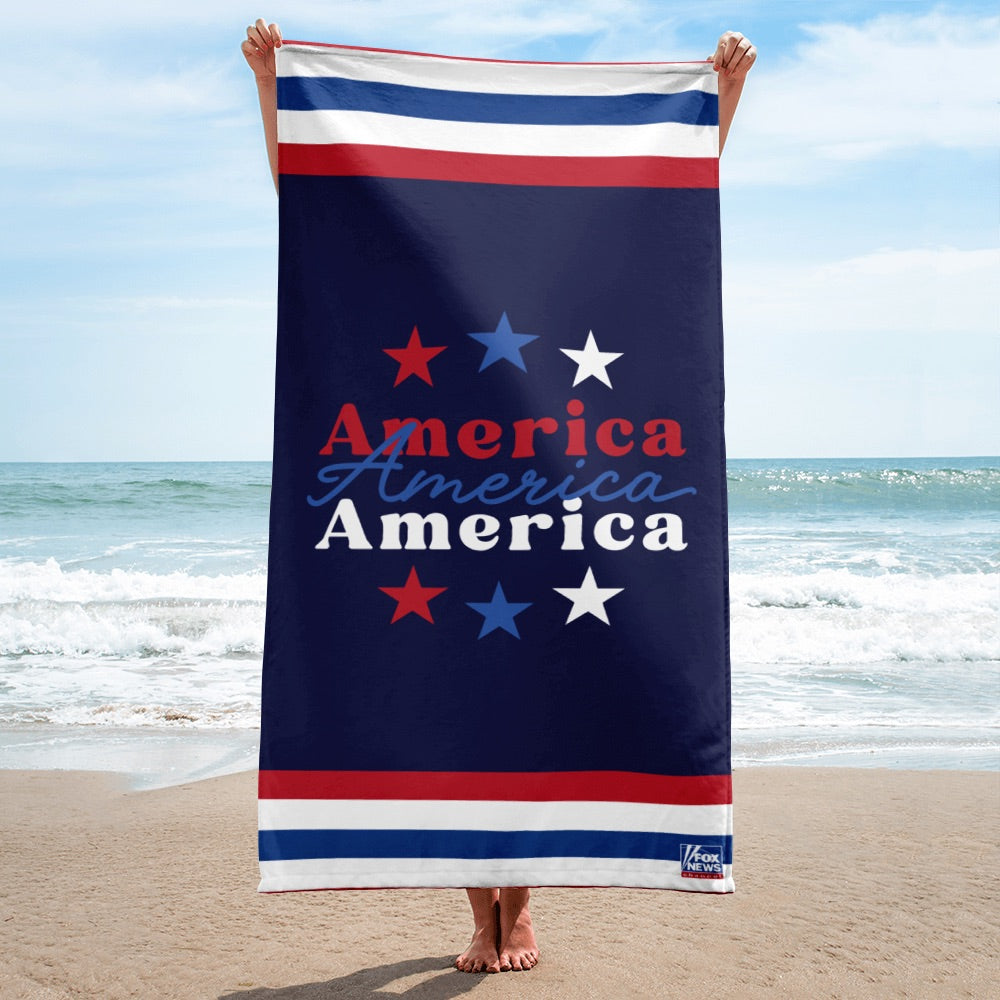 A patriotic American beach towel with the FOX News logo folded neatly in a clean suburban home.