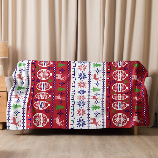 Close-up shot of the FOX News Holiday Sherpa Blanket showcasing the plush texture and crisp holiday styling.