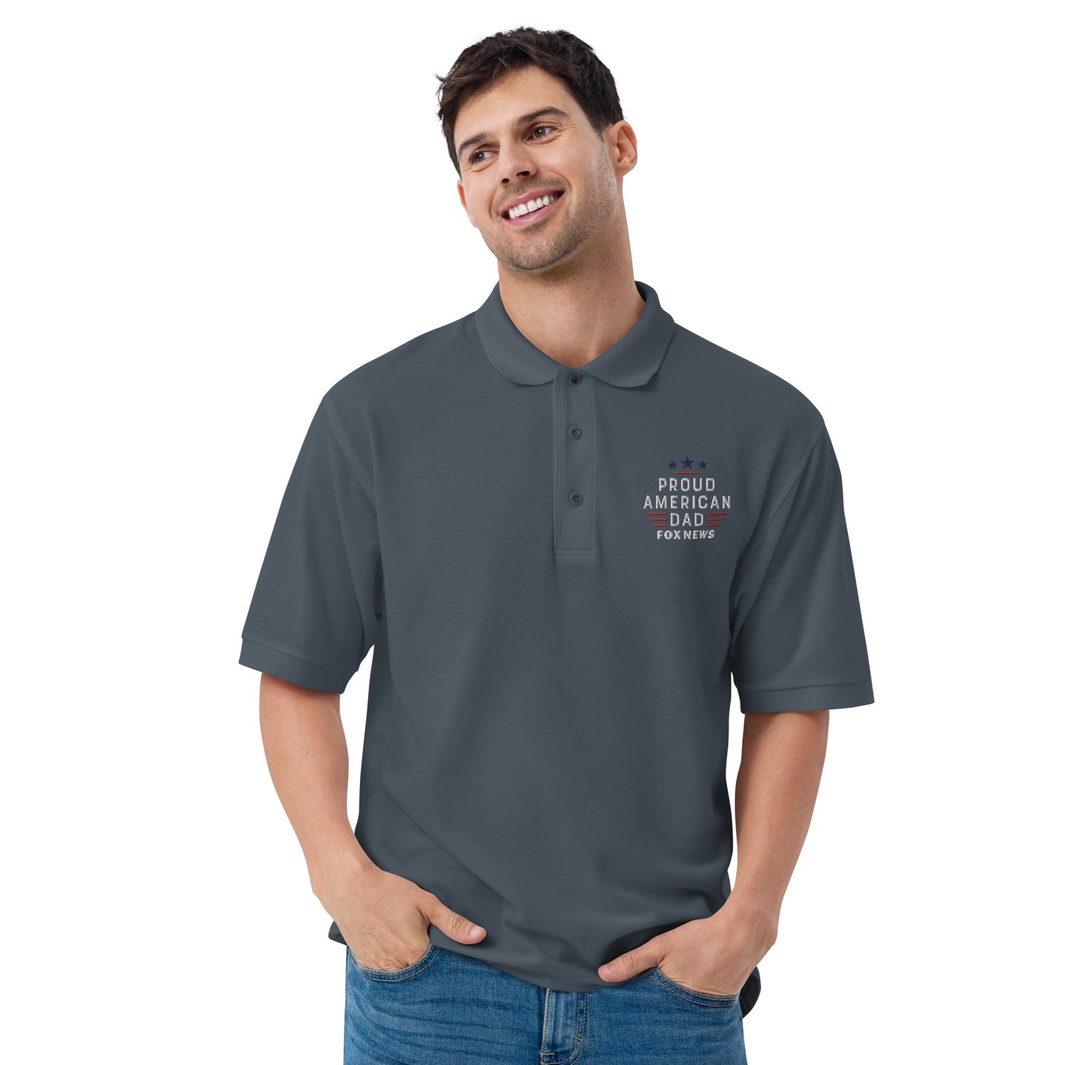 An outdoor lifestyle setting with natural morning light displaying the Navy colorway of the FOX News Proud American Dad polo shirt.