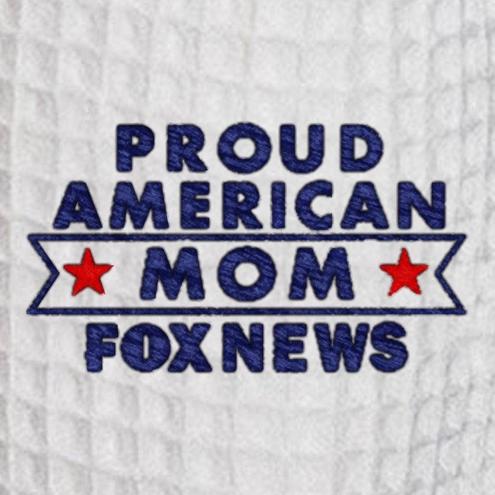 Close-up of the crisp embroidery reading Proud American Mom on the chest of the waffle-knit robe.