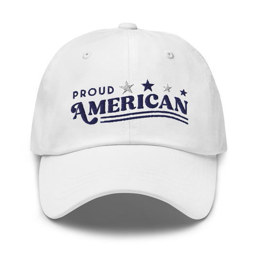 A front view of the FOX News Proud American embroidered hat in White, displayed on a clean wooden table in a brightly lit American home setting.