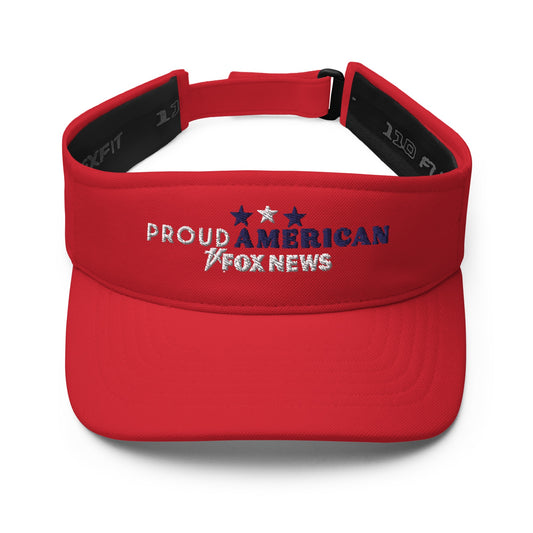 A crisp navy FOX News Proud American visor featuring white embroidery on a wooden table in a sunlit American backyard.