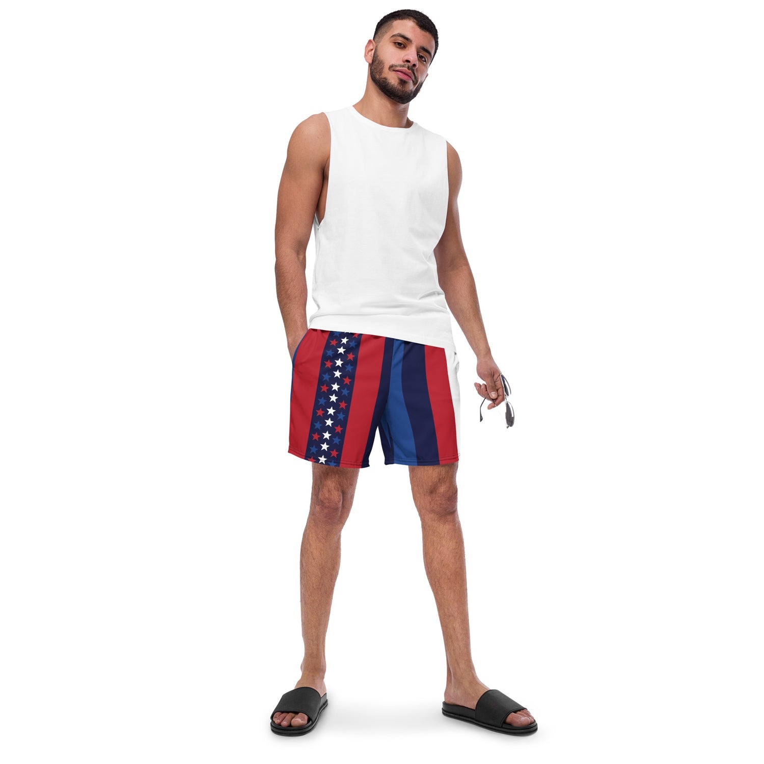 Patriotic FOX News swim trunks shown in a suburban American backyard setting next to a pool.