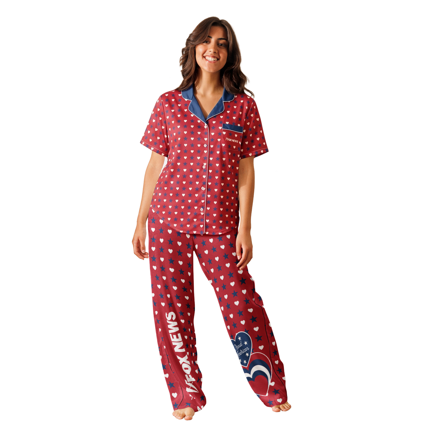 A neatly folded stack of FOX News Proud American apparel including the women's pajama top on a wooden surface.