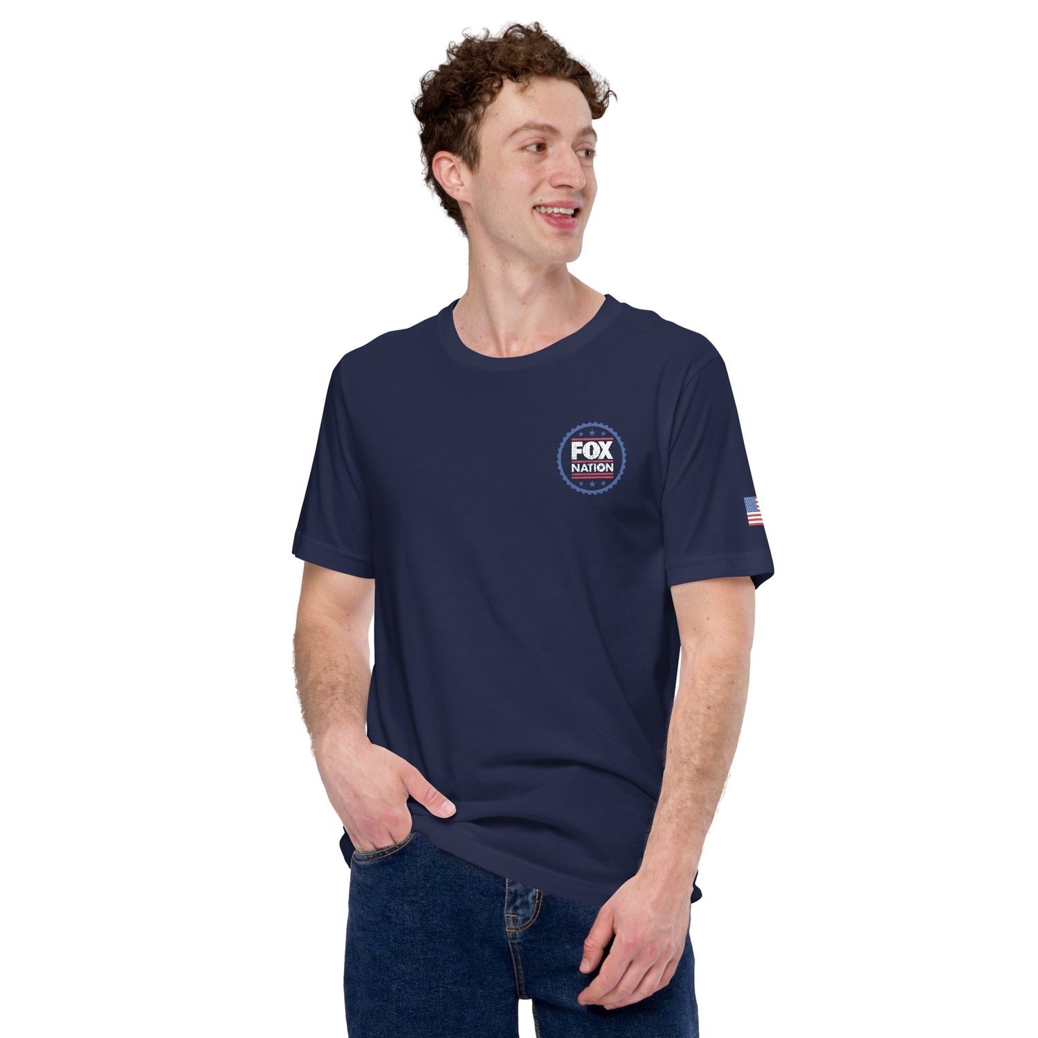 The *FOX Nation* Badge T-shirt folded neatly on a wooden table in a bright, modern American home.