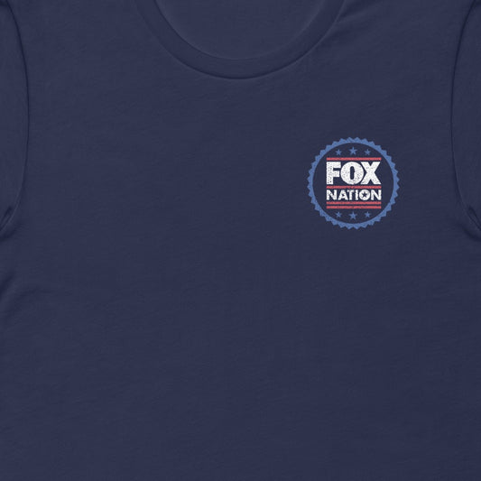 A close-up shot of the crisp white and red *FOX Nation* badge logo on the chest of the navy t-shirt.