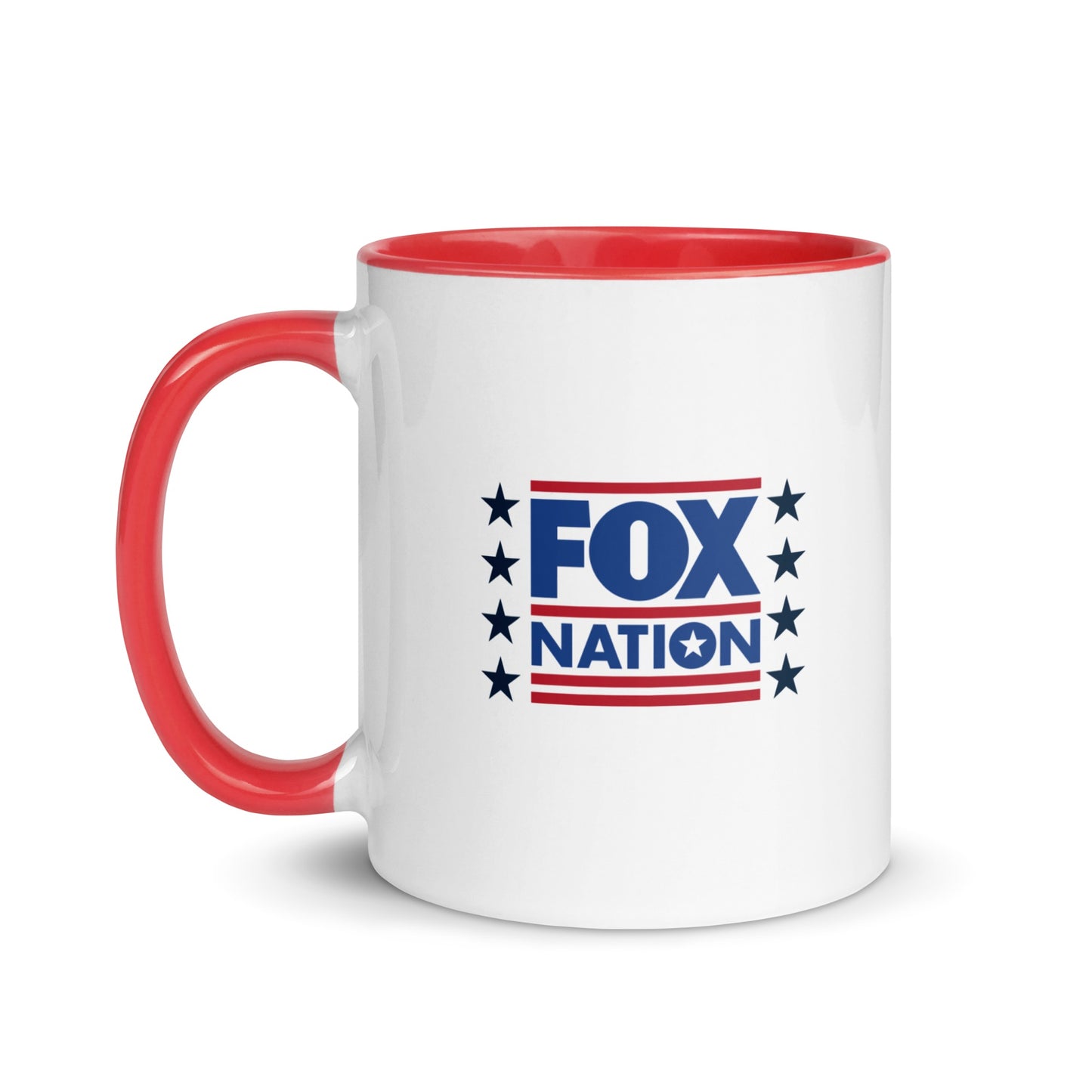 A white ceramic FOX Nation Stars Mug with a vibrant red interior sitting on a clean wooden table in a brightly lit American home.