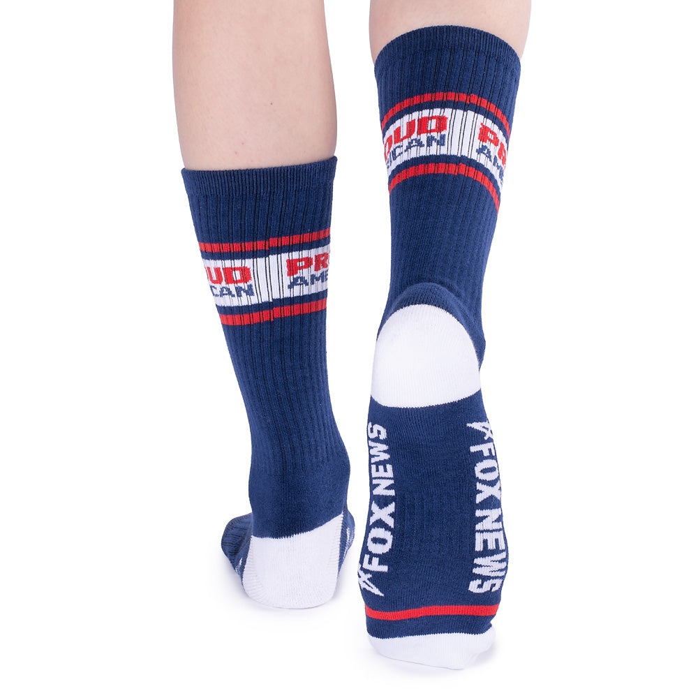 A pair of *FOX News* *Proud American* Athletic Socks in White shown in a clean, suburban American home setting.