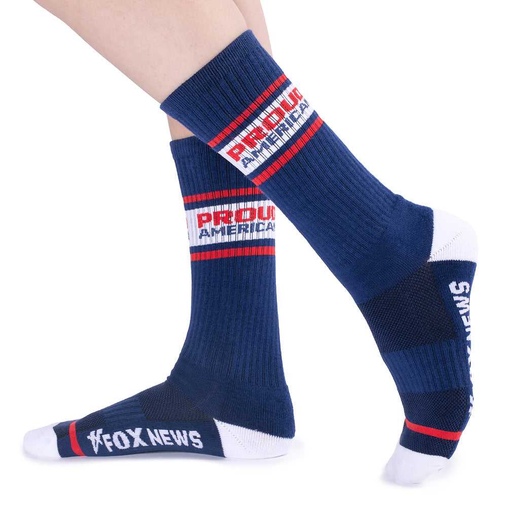 The *FOX News* *Proud American* Athletic Socks neatly folded on a modern living room coffee table.