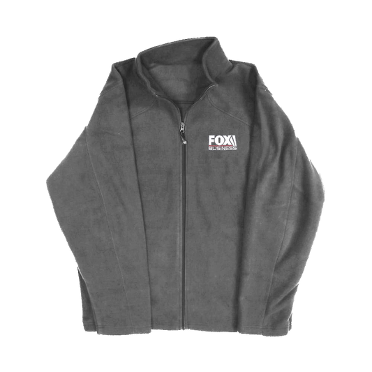 A man in a modern American backyard wearing a charcoal fleece jacket with the FOX Business logo.