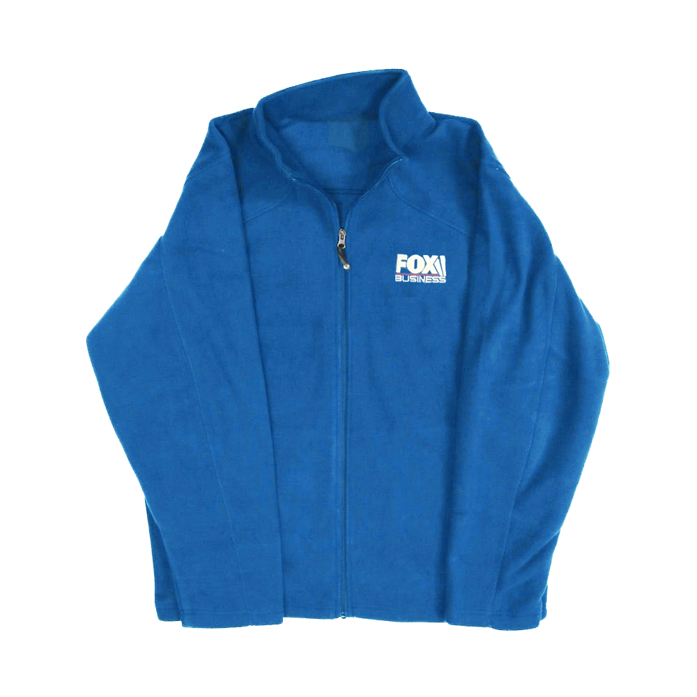 A professional women's royal blue fleece jacket featuring the FOX Business logo placement, shown in a clean American home setting.