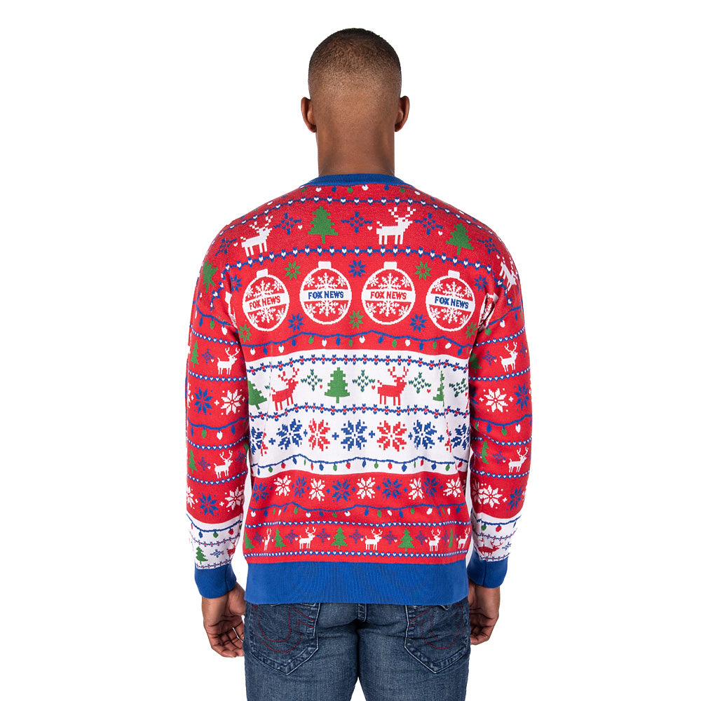 An outdoor winter lifestyle shot showcasing a loyal FOX News viewer enjoying a crisp morning in the FOX News Knit Holiday Sweater.