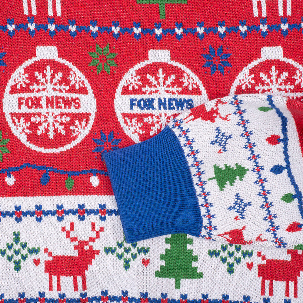 A stylish armchair in a festive holiday home setting with the FOX News Knit Holiday Sweater draped neatly over the back.