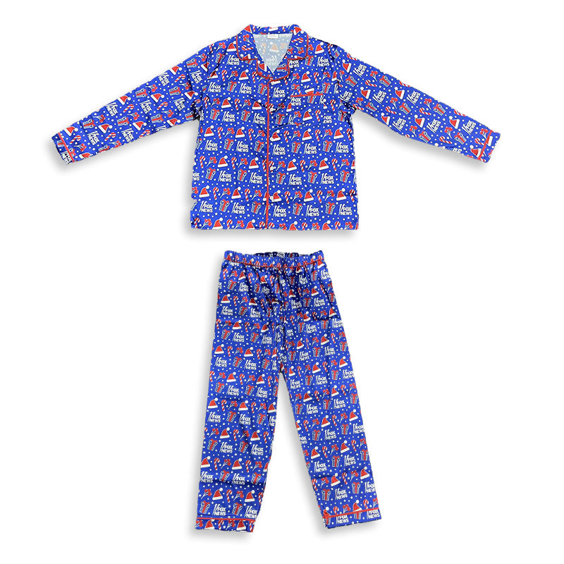 A man wearing *FOX News* Holiday Men's Pajamas in a modern American living room setting near a fireplace.