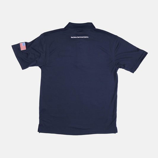 Close-up of the crisp *FOX News* logo embroidered on the chest of a premium men's polo shirt.