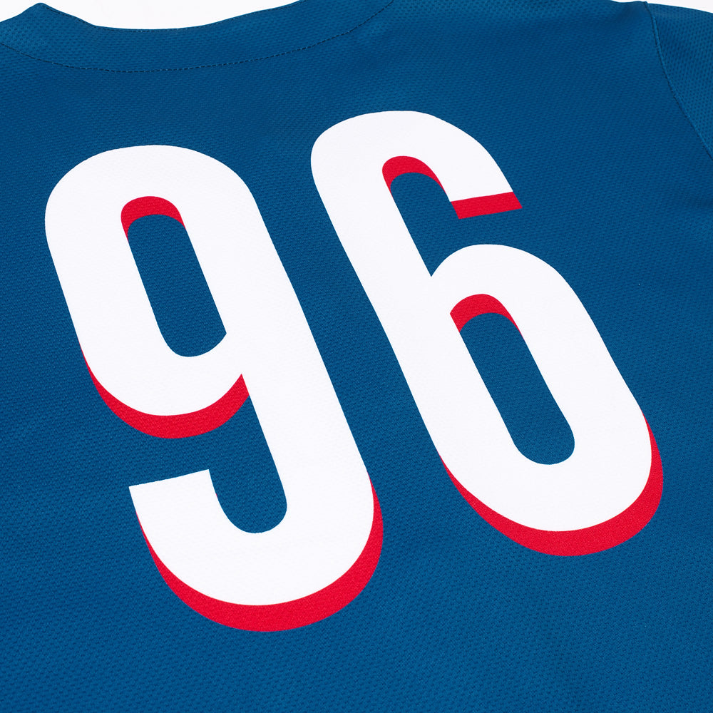 Close-up of the high-quality fabric and stitching on the blue button-down jersey.