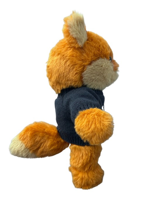 Front view of the patriotic fox stuffed animal showing its red, white, and blue design elements.