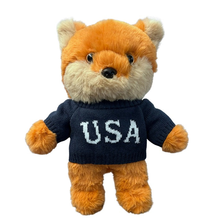 Official FOX News For All America Fox Plush shown in a bright, clean American living room setting.