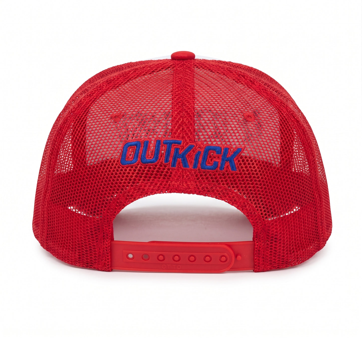 Side profile of the red OutKick hat resting on a wooden surface in bright natural light.