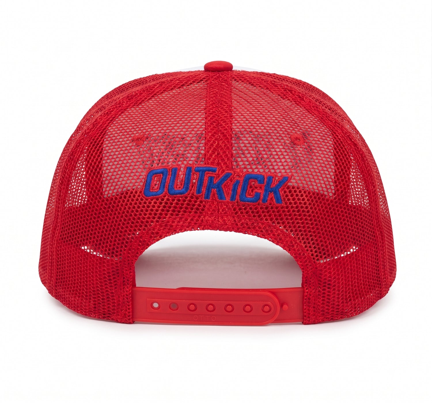 Side profile of the red OutKick hat resting on a wooden surface in bright natural light.