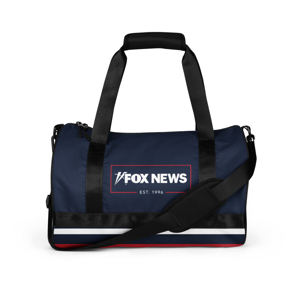 The FOX News Logo Gym Bag placed neatly in a modern suburban home entryway.