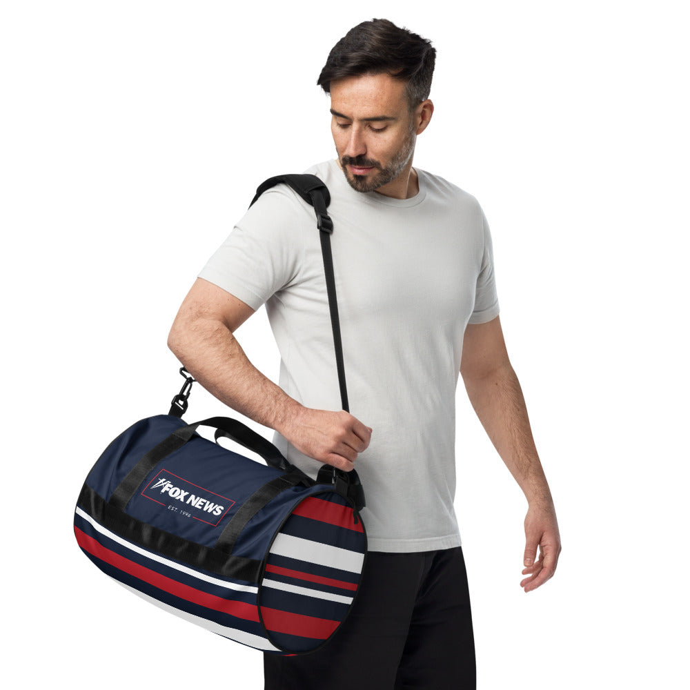 An outdoor lifestyle setting featuring the FOX News gym bag ready for a morning workout session.