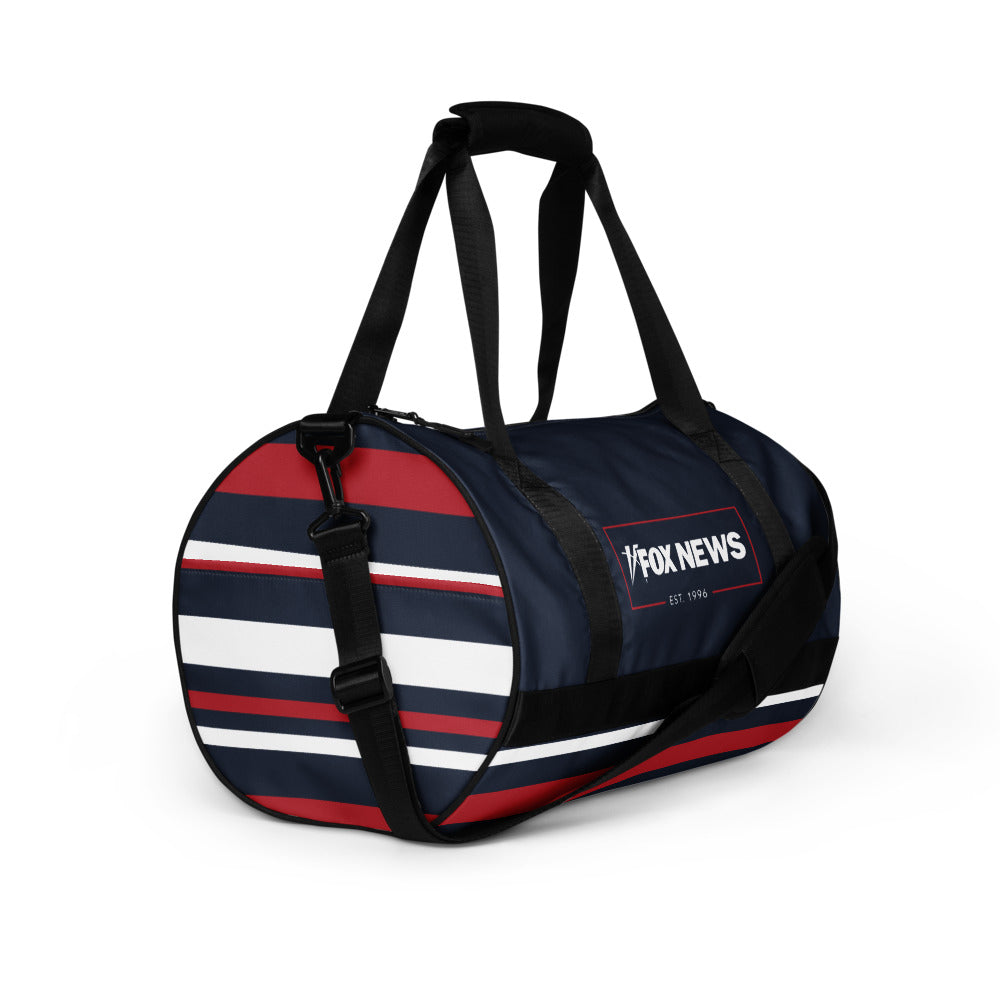 A side angle shot highlighting the spacious interior and sturdy construction of the FOX News duffel bag.