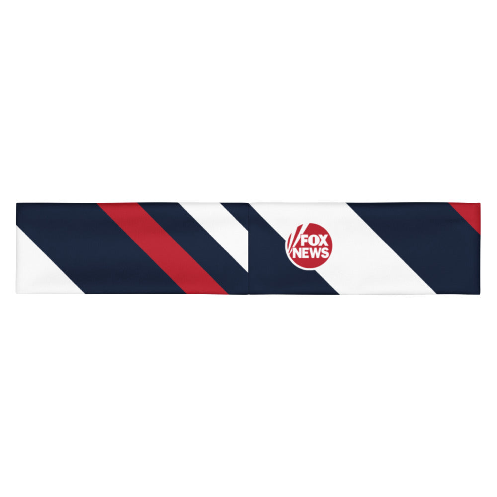 A crisp product shot of the FOX News logo headband displaying the bold network emblem on a clean, modern American living room background.
