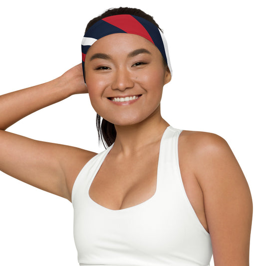 A lifestyle shot of an individual wearing the FOX News logo headband during an outdoor morning fitness walk in a suburban American neighborhood.
